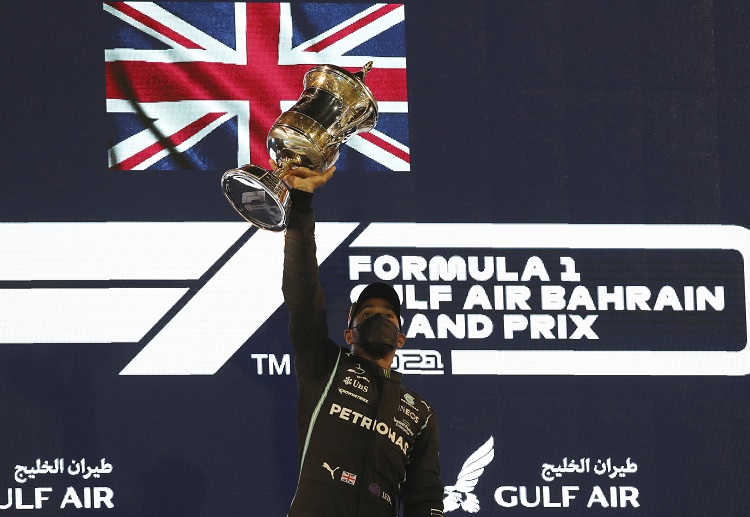 Mercedes star Lewis Hamilton lifts his trophy after winning the Bahrain Grand Prix