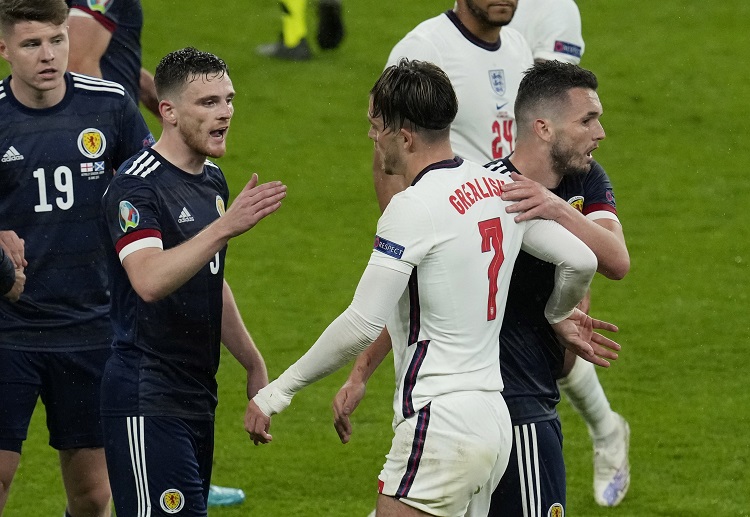 England's Jack Grealish shakes hands with Scotland's Andrew Robertson following their Euro 2020 draw
